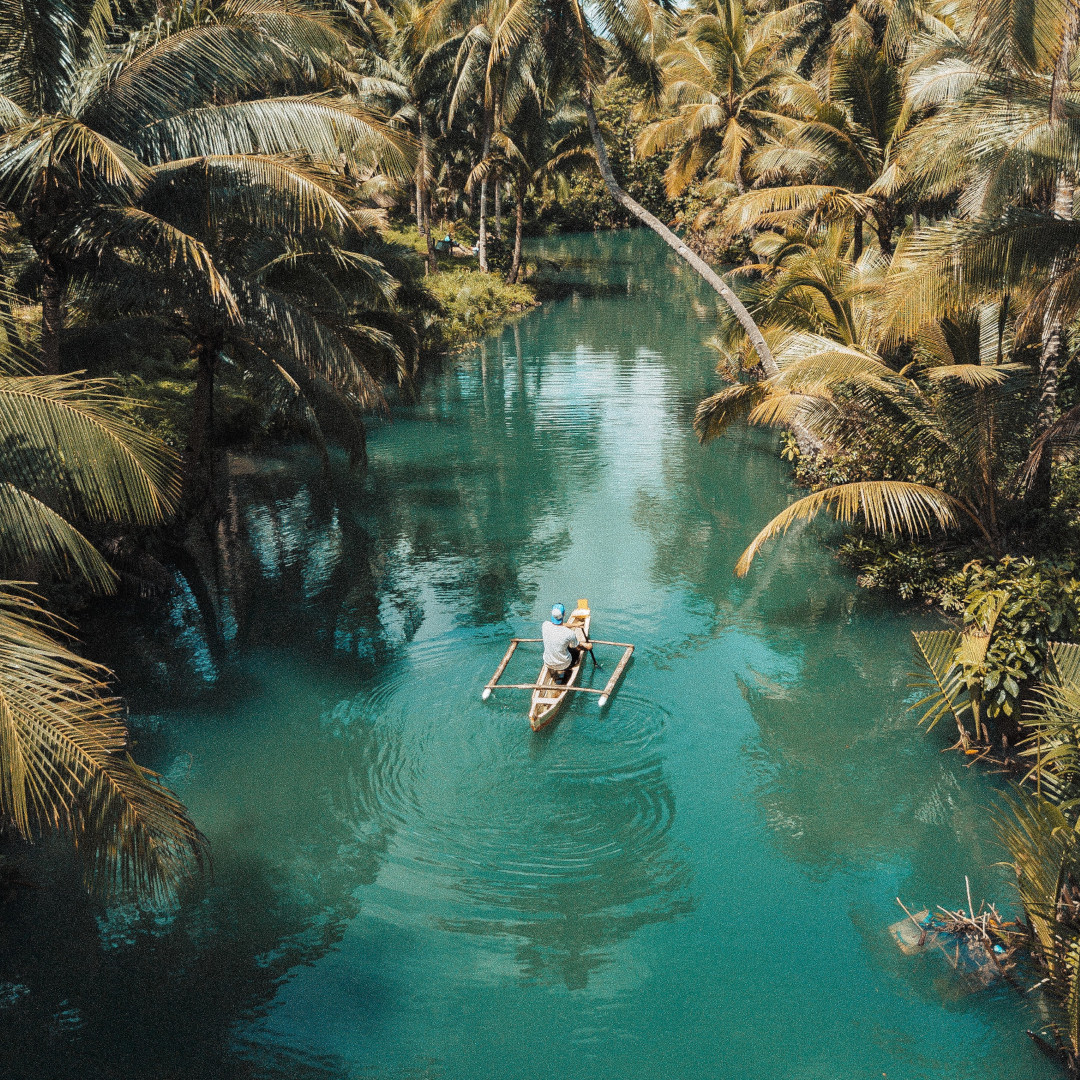 A person in a canoe on the water.